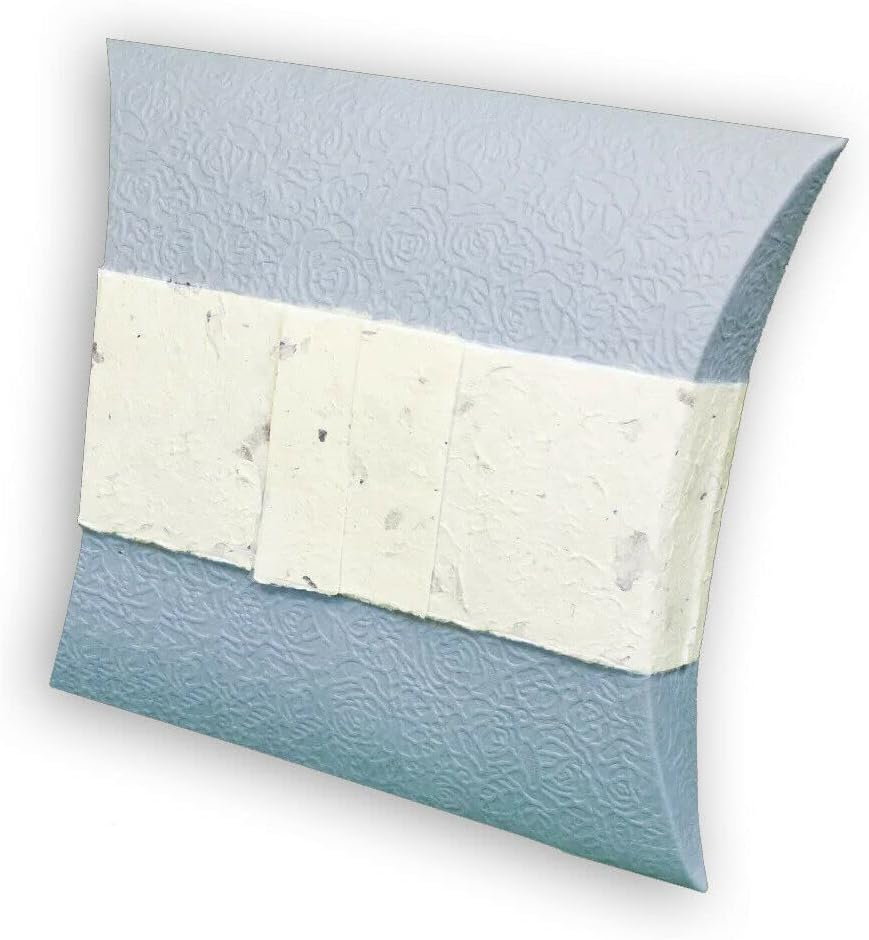 Textured blue and white biodegradable water burial pillow urn on a white background