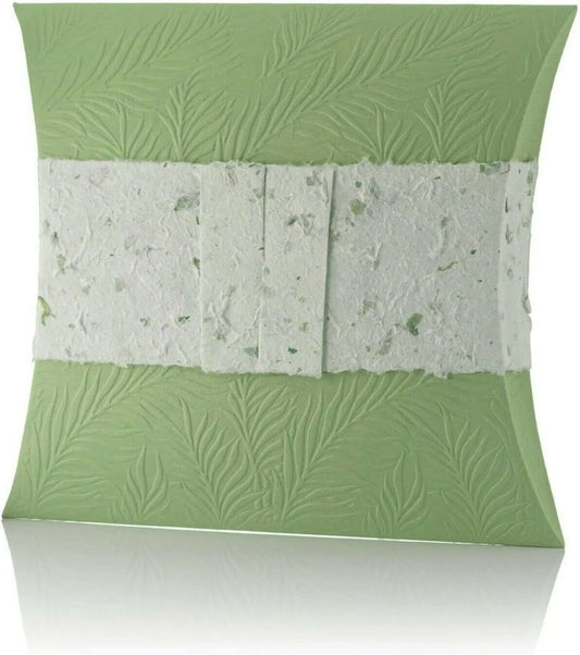 Green biodegradable water burial pillow urn with leaf pattern on a white background